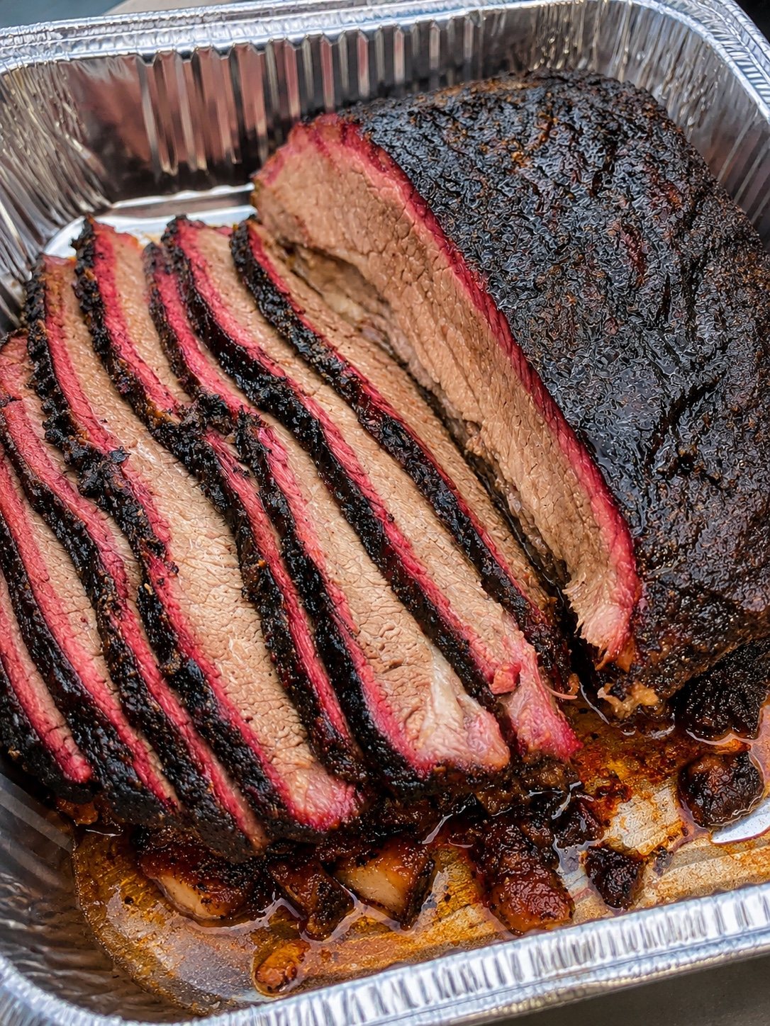 Sliced smoked brisket with deep bark