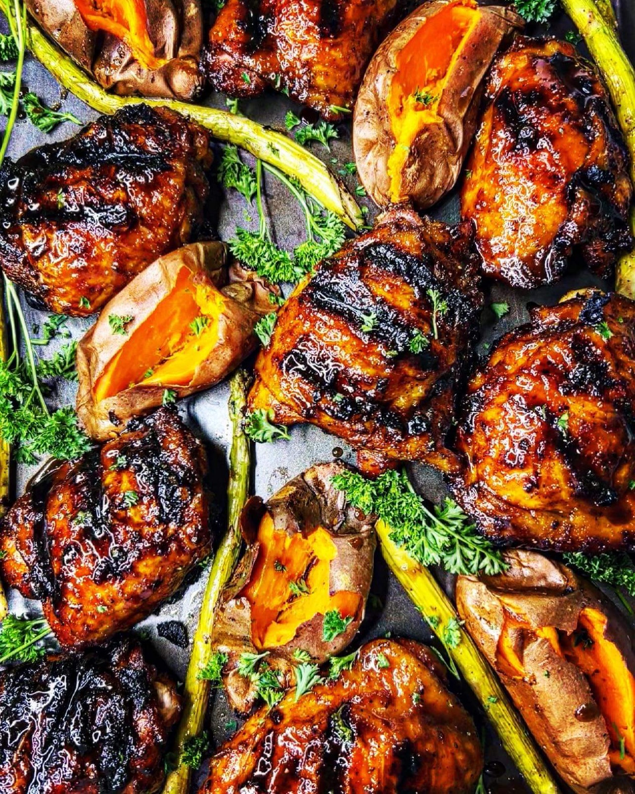 Glazed chicken with sweet potatoes, asparagus and herbs