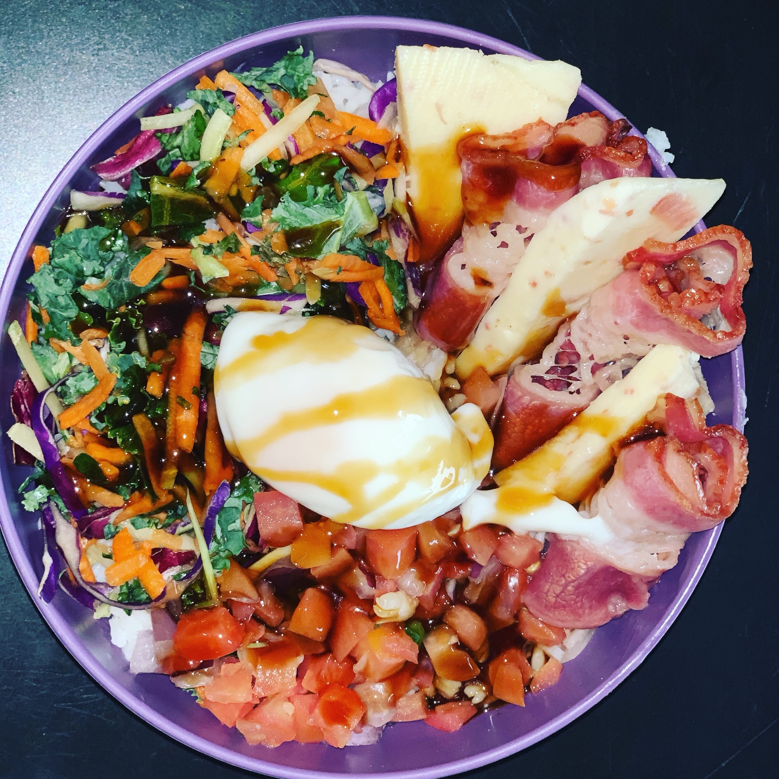 Savory bowl with greens, bacon, egg and pineapple