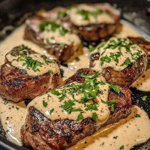 Seared steak medallions with herb cream sauce